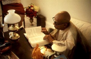 Srila Prabhupada reading his own book
